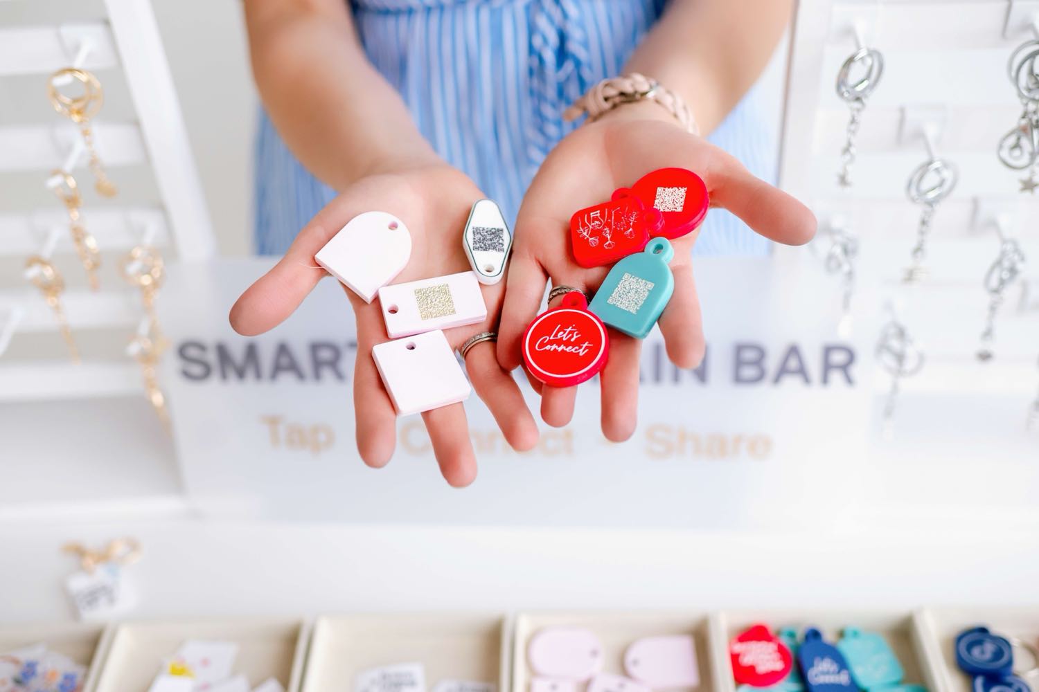 A handful of TapLoop tags in different shapes and colors