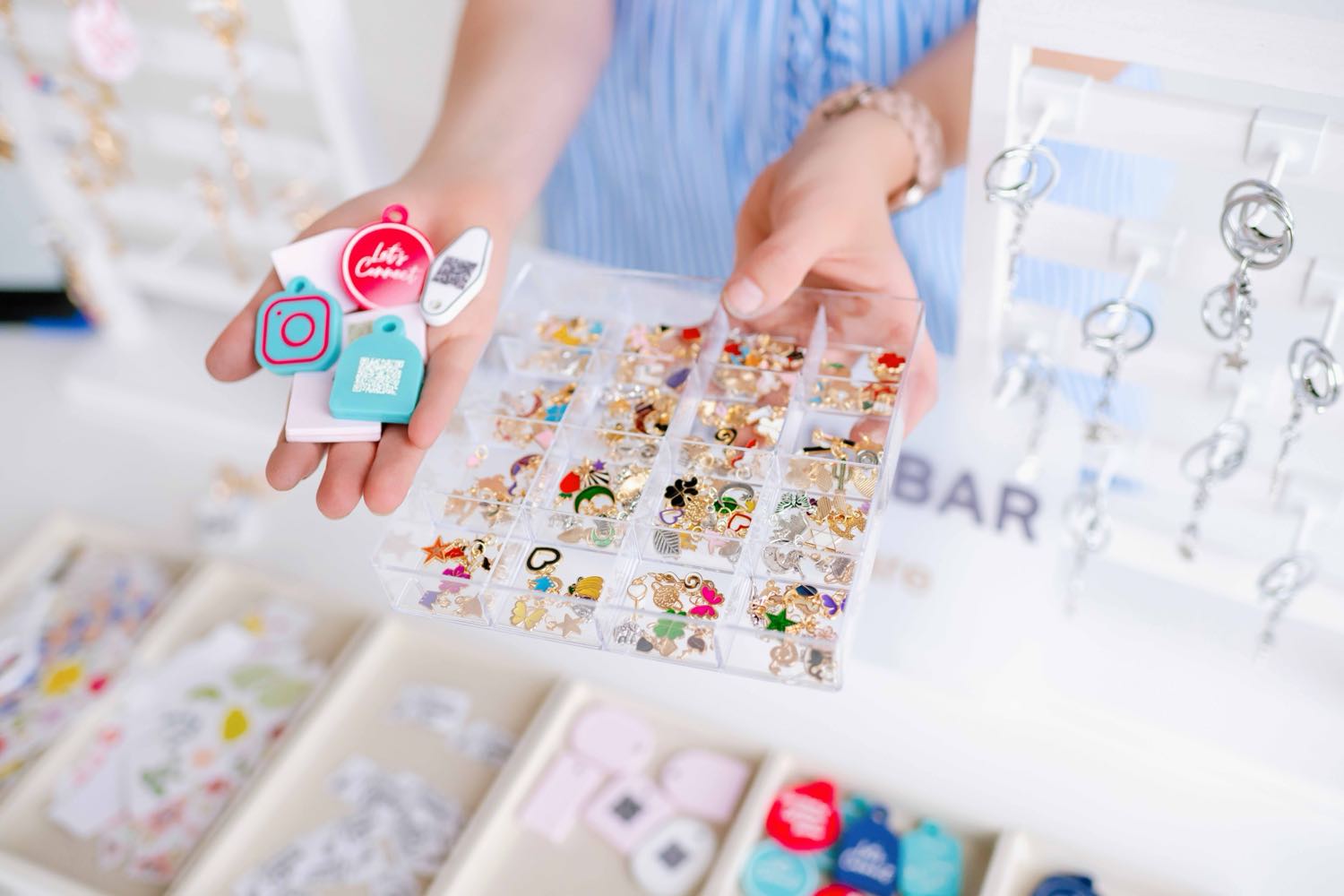 Choosing TapLoop keychains and charms at the Smart Keychain Bar